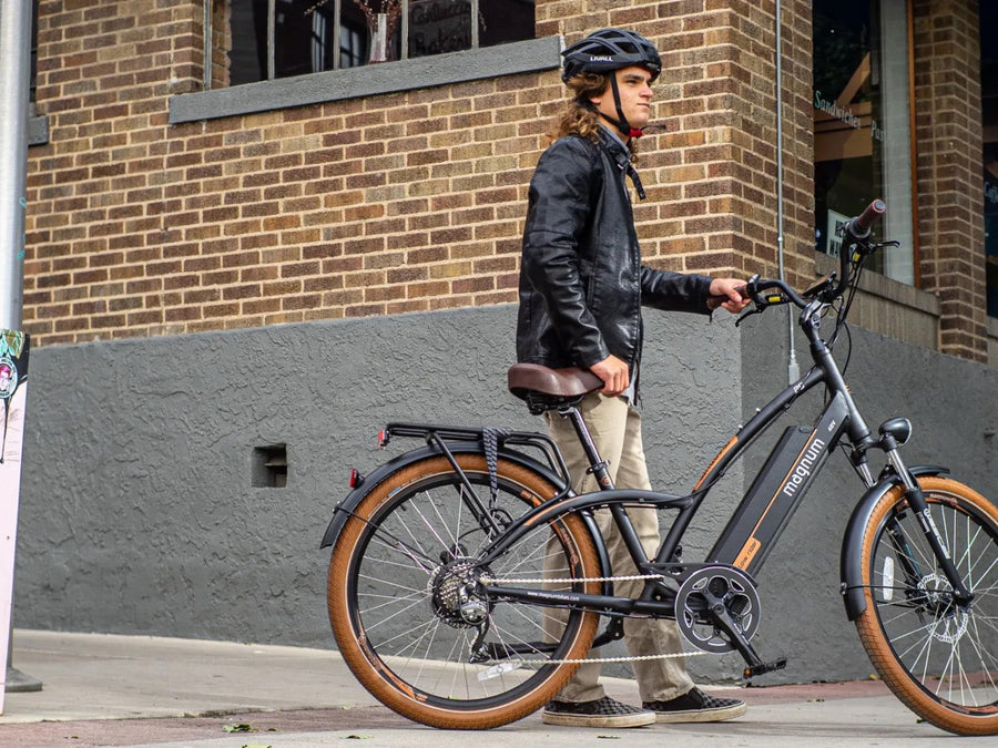 Rider with a Magnum eBike on a Coast Highway street corner — RIDE Cyclery services every Magnum model